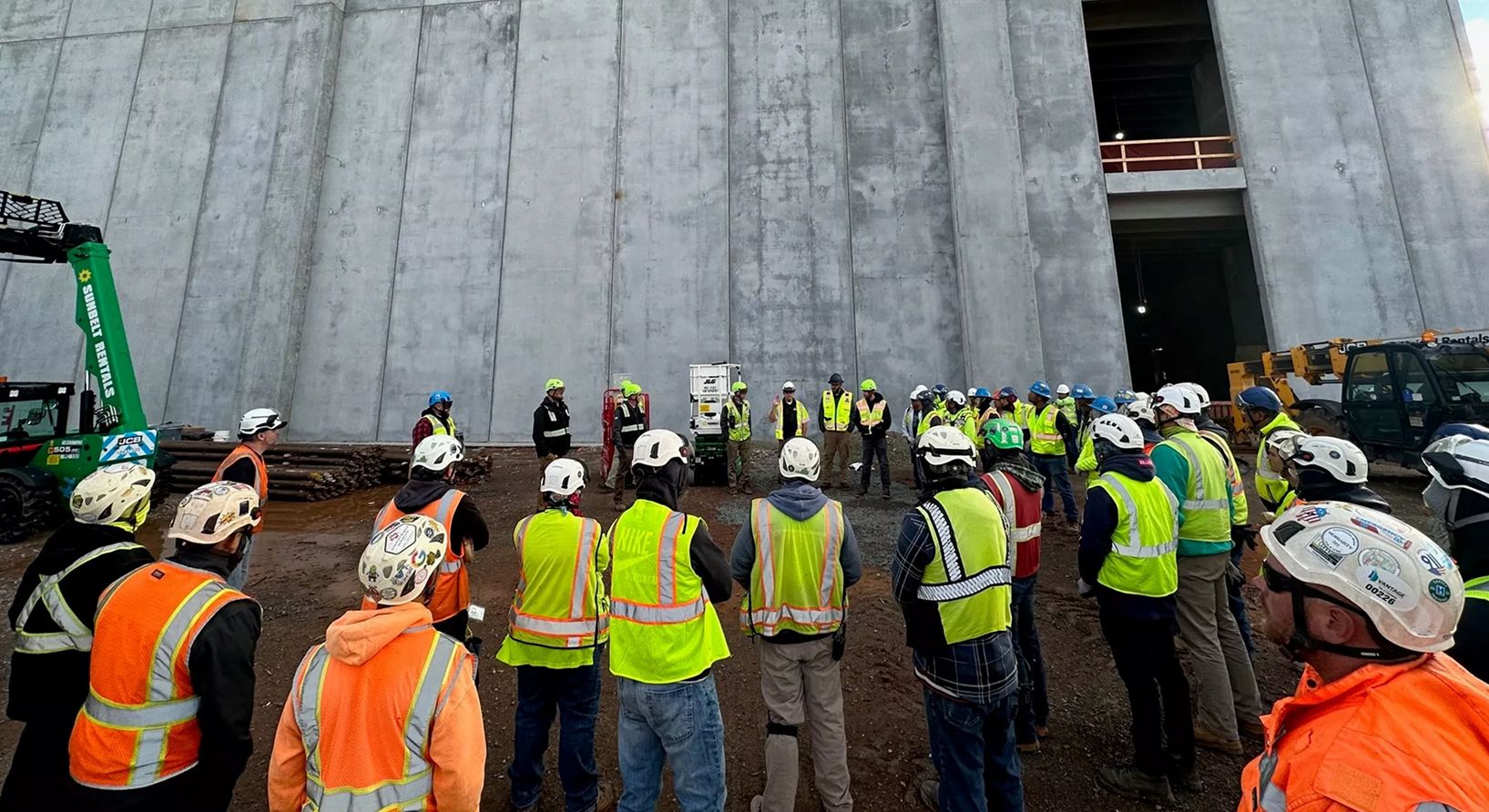 Aligned Data Centers team photo outdoor construction meeting